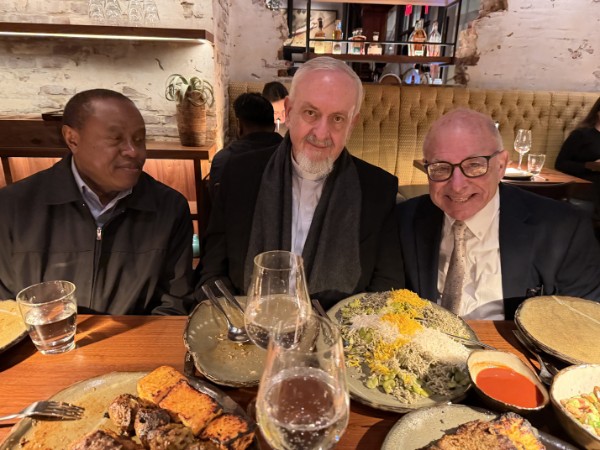 Bob Leaf at dinner with two guests.